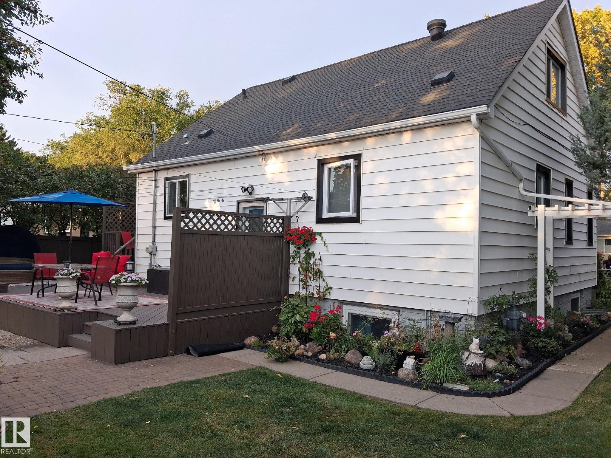 Multi-level wood-finish deck with privacy lattice - 11908 131 Street Nw, Edmonton, AB