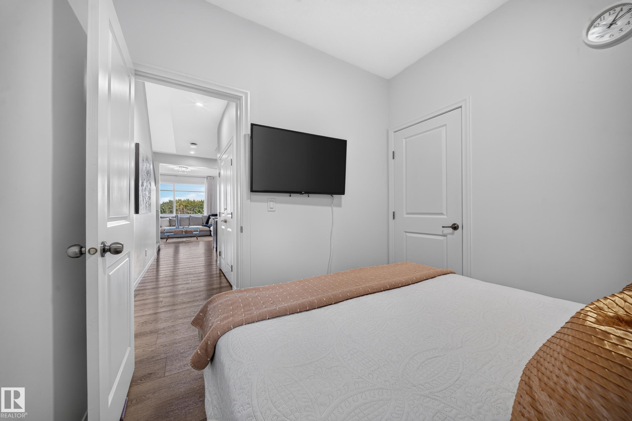 Wall-mounted television with visible wiring - 4104 3 Avenue Sw, Edmonton, AB