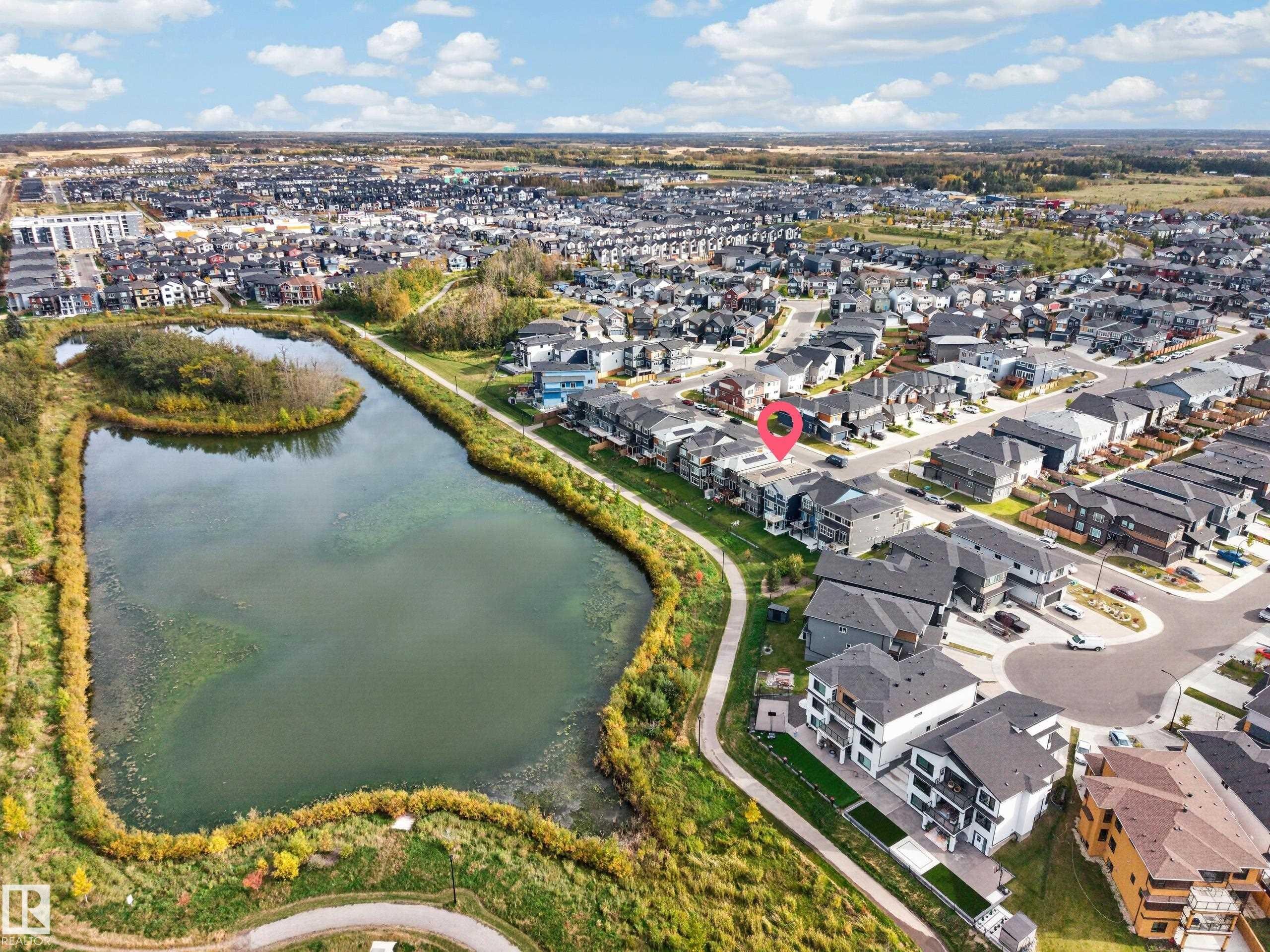 Urban neighborhood with a residential street grid and a natural pond - 4104 3 Avenue Sw, Edmonton, AB