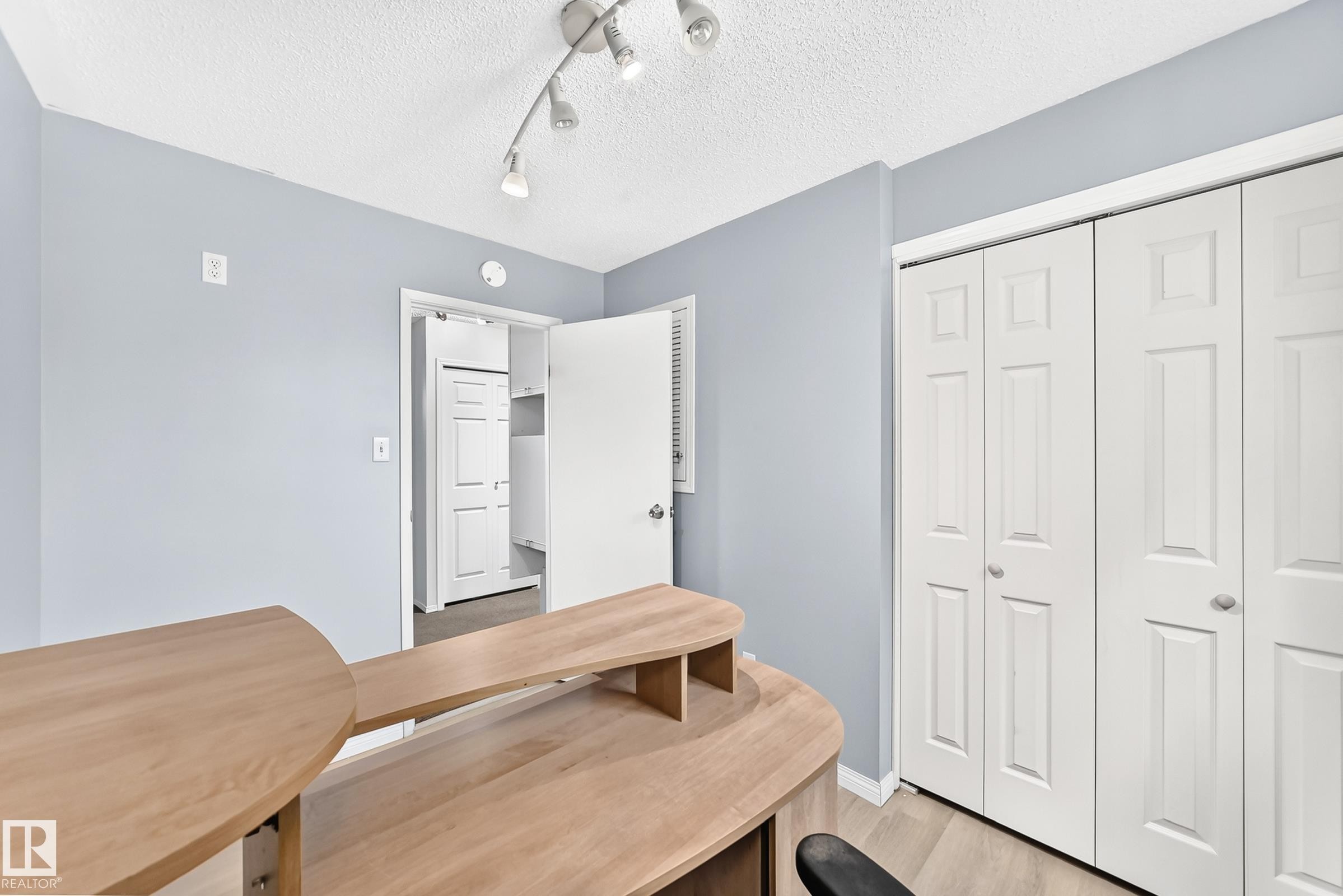Track lighting fixture, panel doors, and neutral wall color - 44 Habitat Crescent Nw, Edmonton, AB