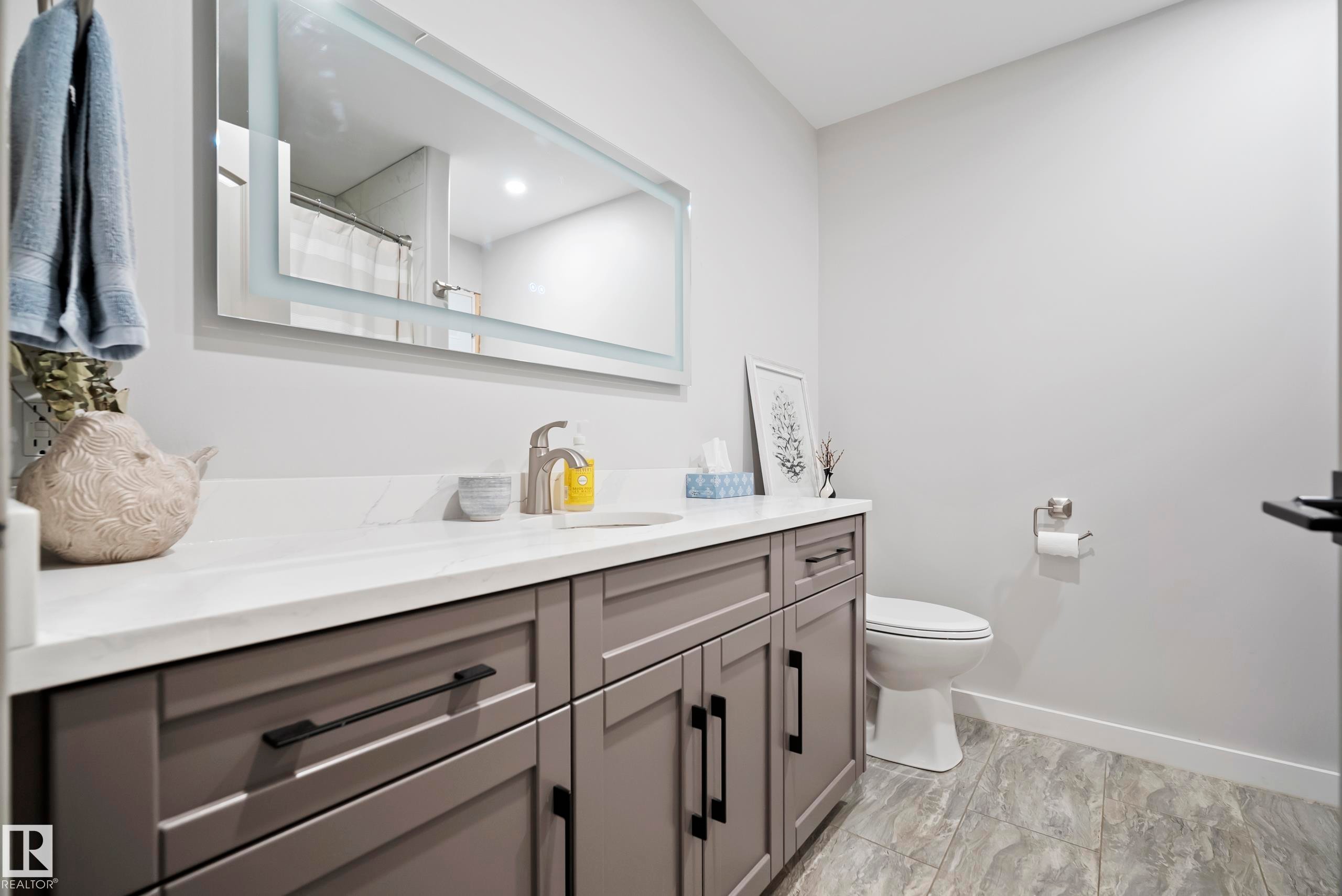 Modern vanity with gray shaker cabinetry and black hardware - 49279 Rge Rd 240, Rural Leduc County, AB