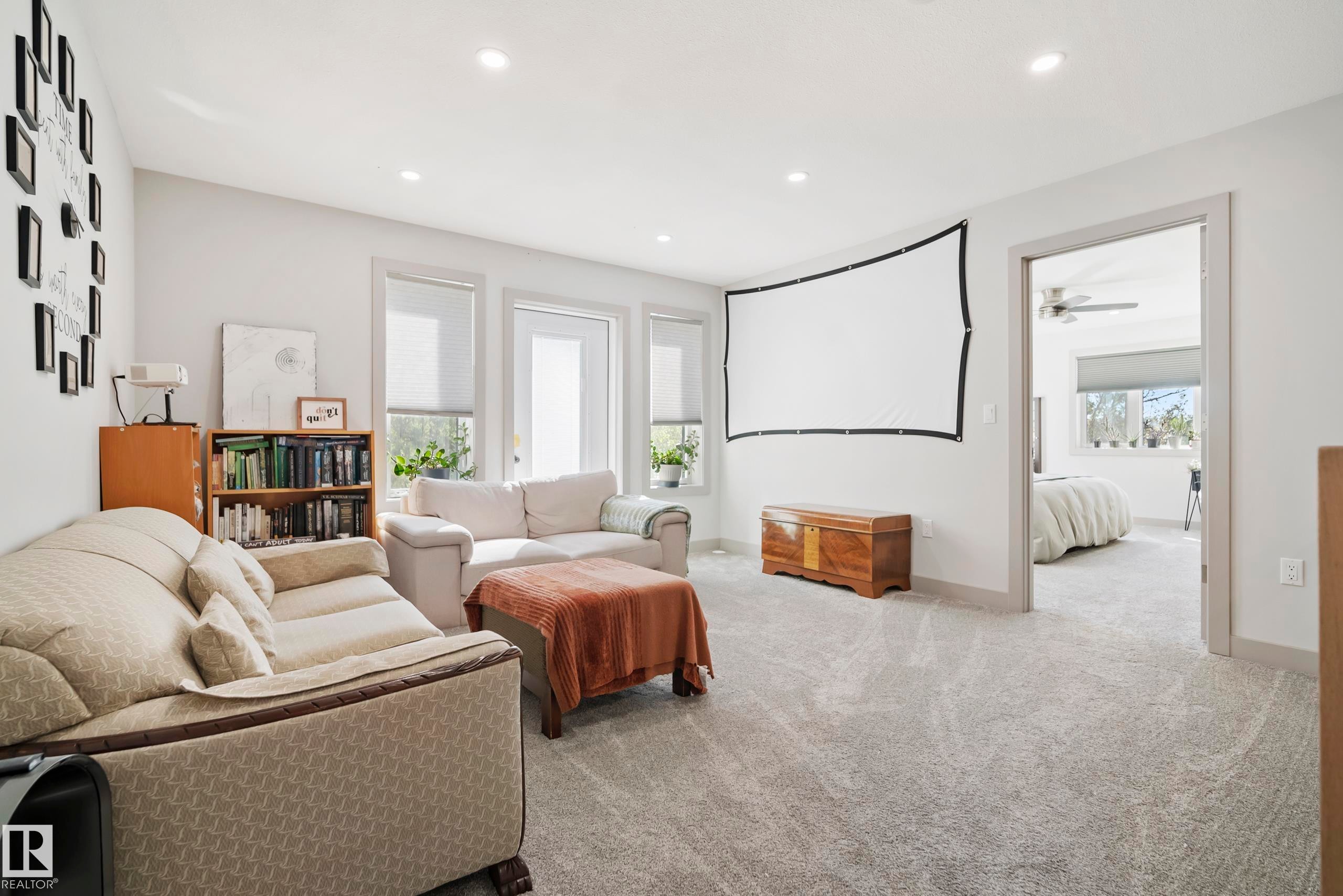 Recessed ceiling lighting, light gray wall paint, multiple windows, light gray carpet, and white trim - 49279 Rge Rd 240, Rural Leduc County, AB