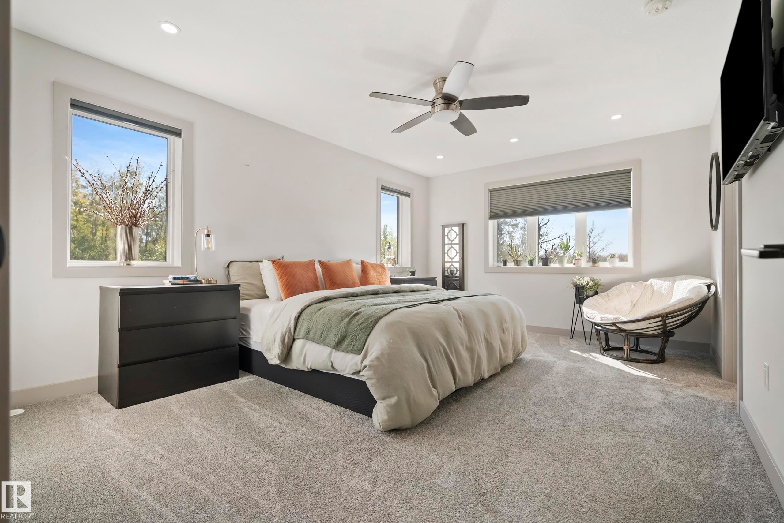 Recessed ceiling lighting, ceiling fan, multiple windows with roller shades, and light-toned carpeting - 49279 Rge Rd 240, Rural Leduc County, AB