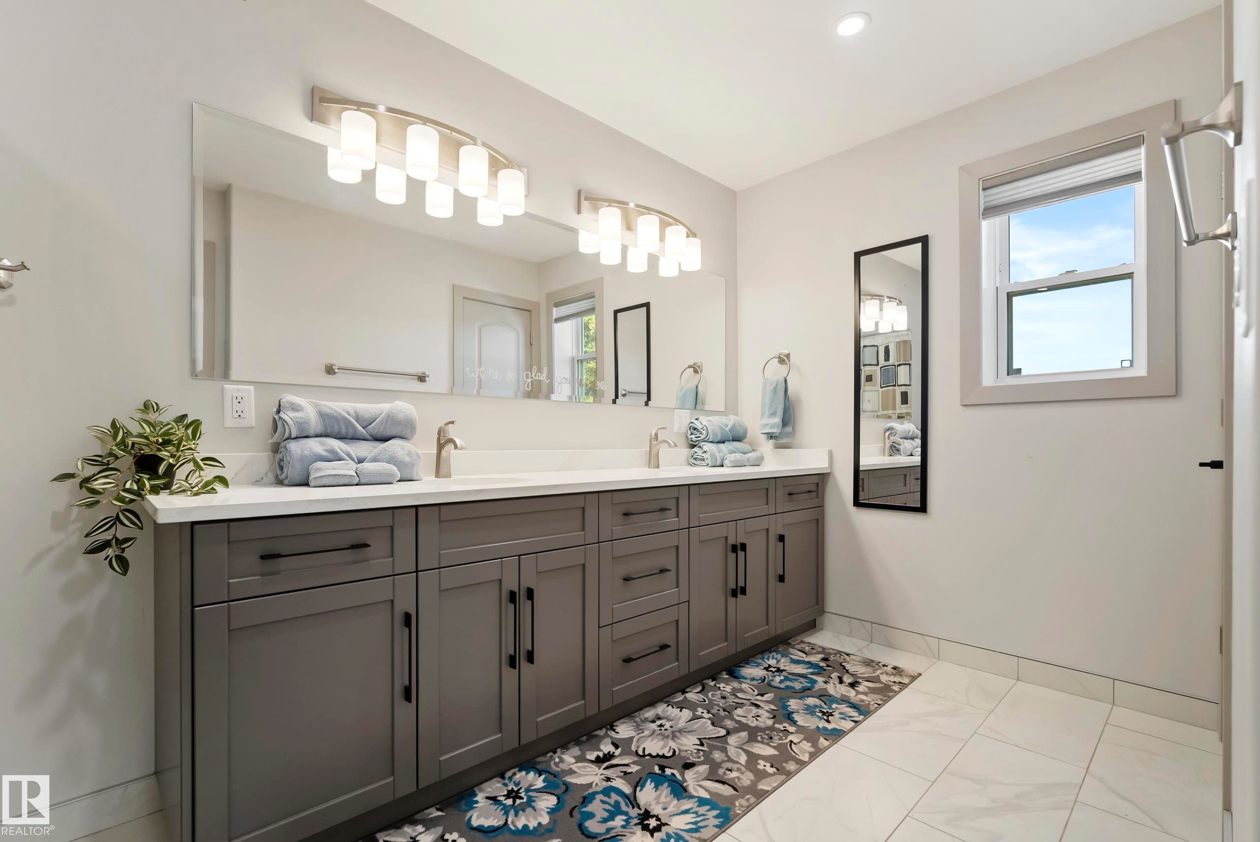 Dual vanity with a white countertop and rectangular undermount sinks - 49279 Rge Rd 240, Rural Leduc County, AB