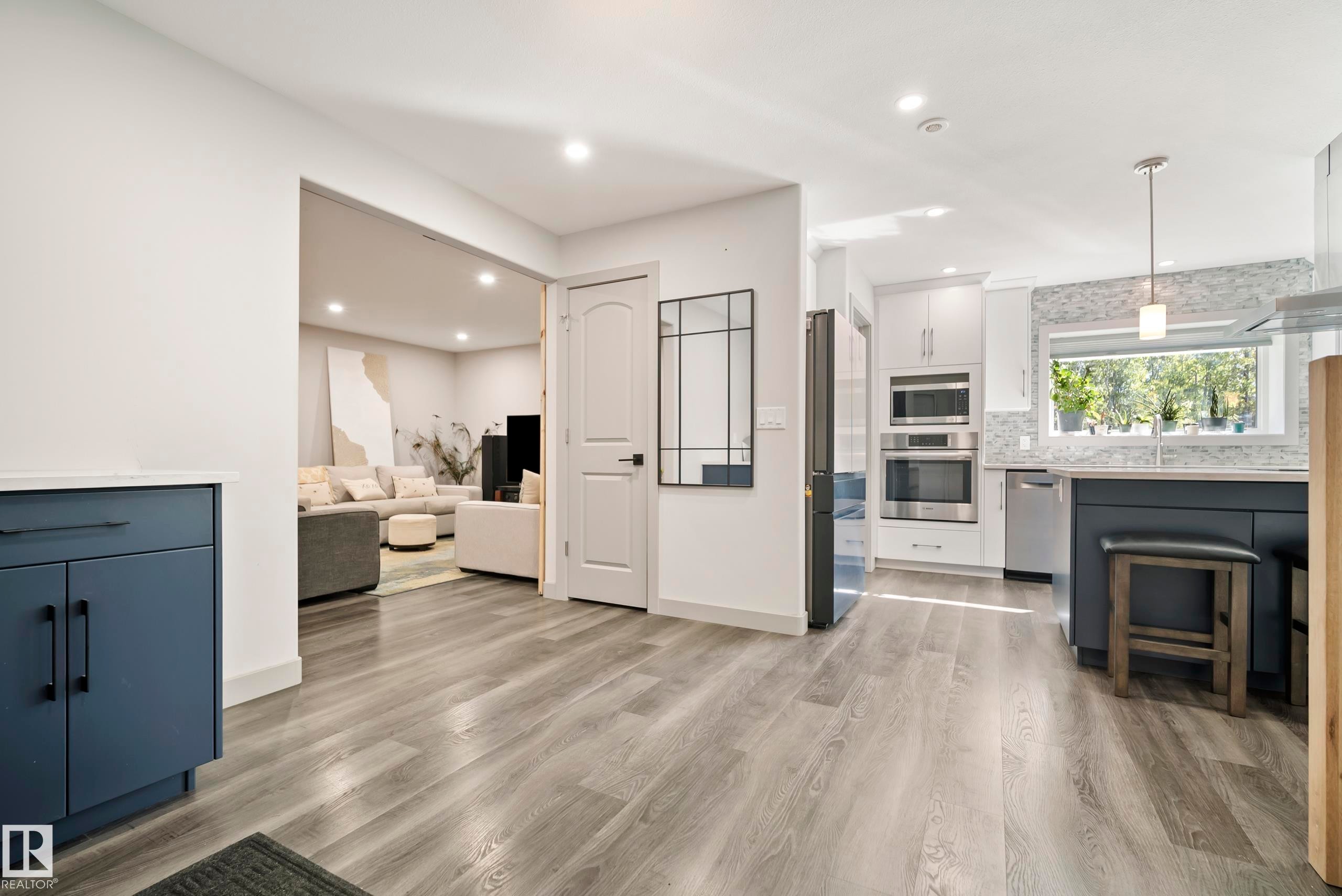 Wood-finish flooring throughout the main level - 49279 Rge Rd 240, Rural Leduc County, AB
