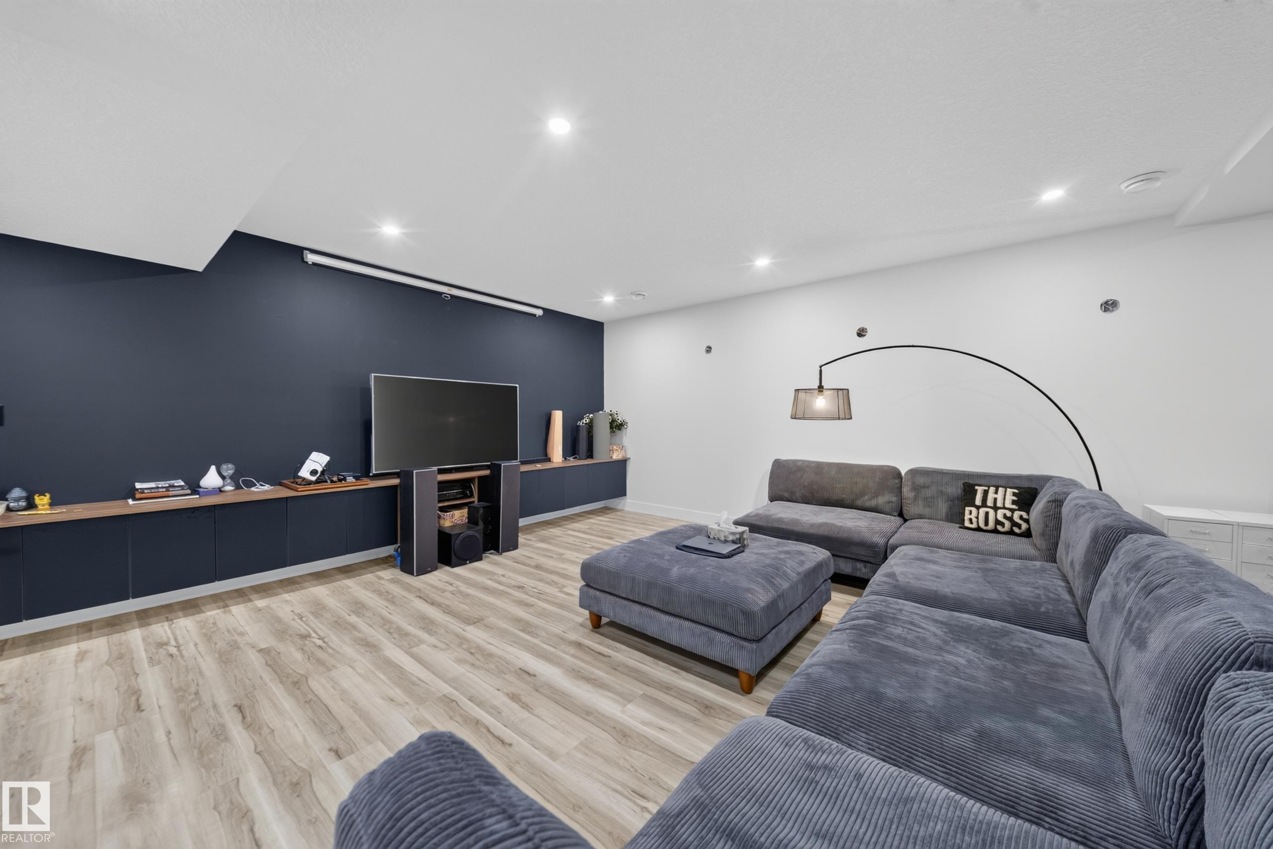 Recessed lighting, wood-finish flooring, and built-in cabinetry with a wood-finish countertop - 719 65 Ave Nw, Edmonton, AB