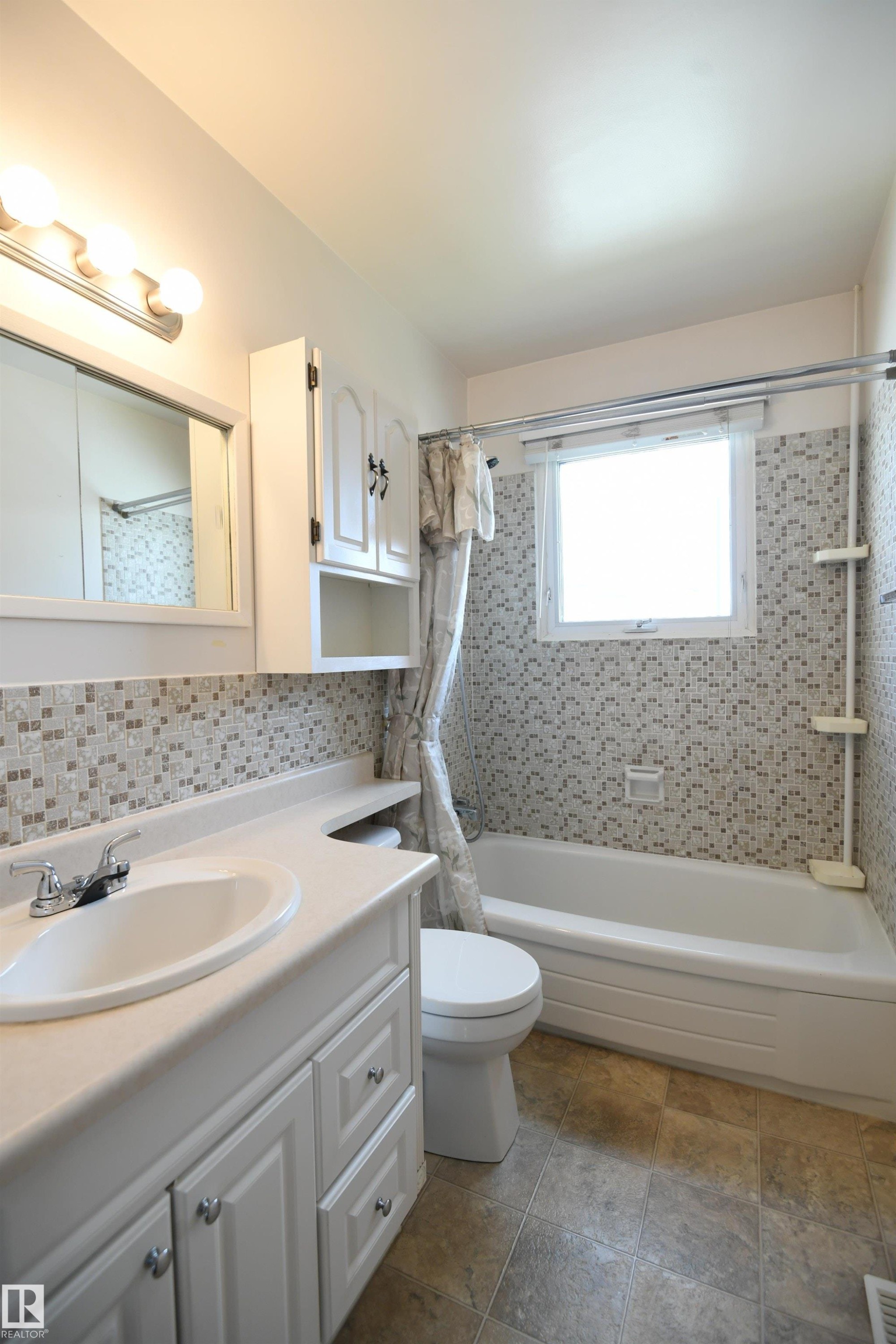 The main bathroom is a 4 piece with a full tub. A second bathroom downstairs also has a stand alone shower, perfect for a growing family, or for guests - 10243 42 Street Nw, Edmonton, AB