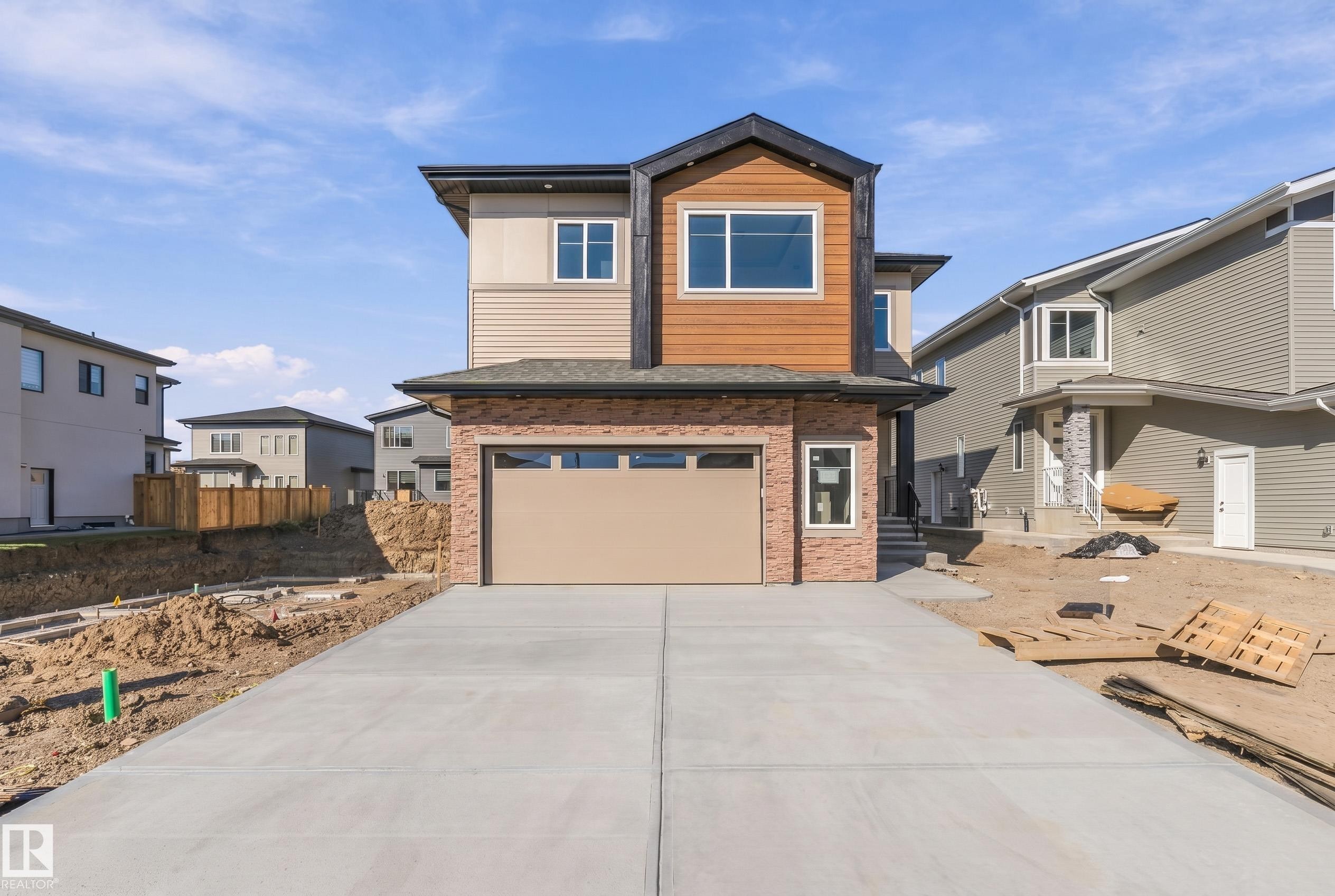 Modern two-story exterior with a concrete driveway - 2720 63 Avenue, Rural Leduc County, AB