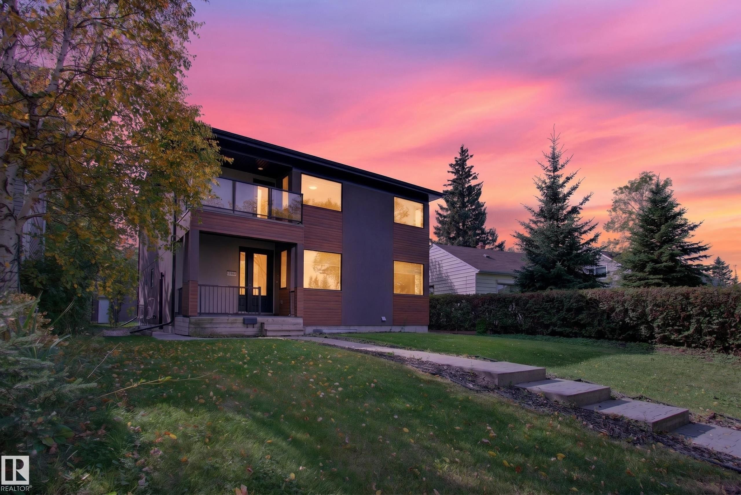 Contemporary exterior with dark siding and wood-finish accents - 11167 62 Avenue Nw, Edmonton, AB