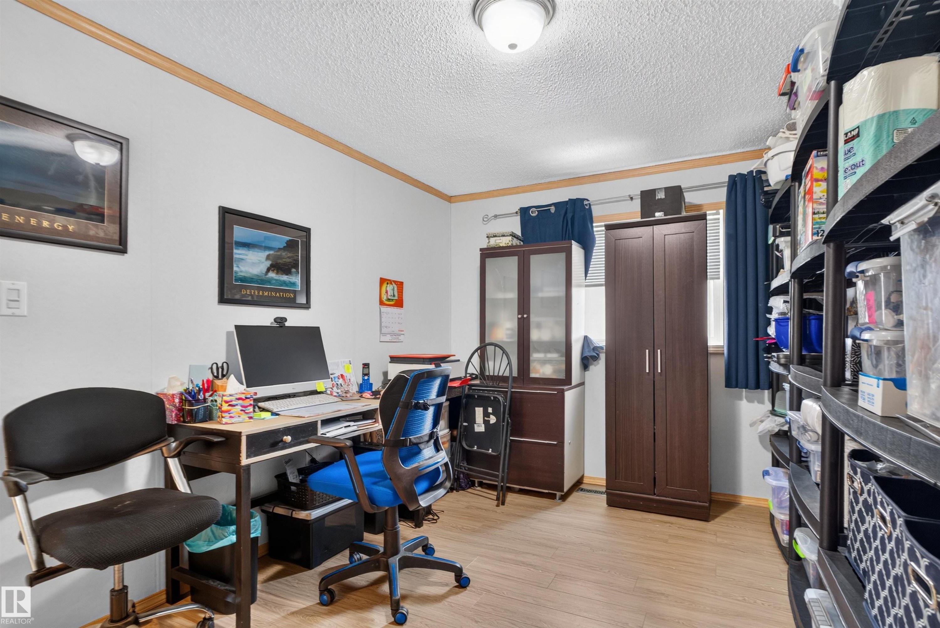 Wood-finish flooring with white wall finishes and wood-toned trim - 1405 53222 Range Road 272, Rural Parkland County, AB