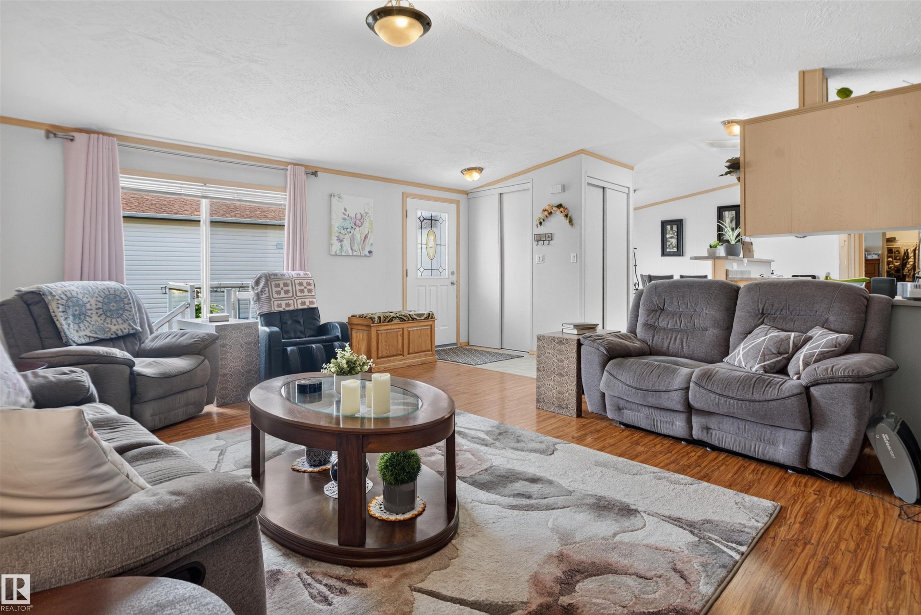 Wood-finish flooring throughout the living space - 1405 53222 Range Road 272, Rural Parkland County, AB