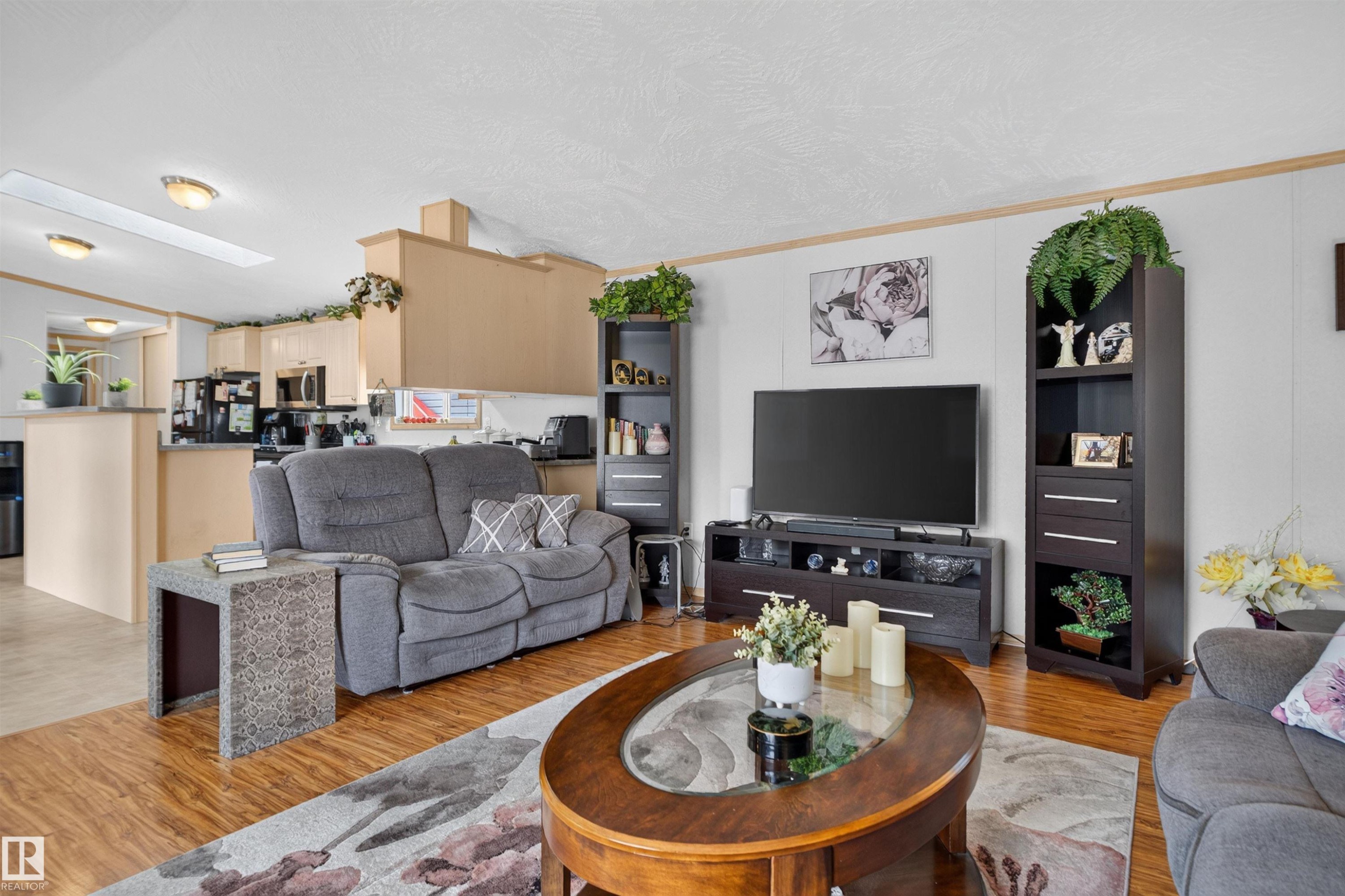 Wood-finish flooring throughout, with a recessed skylight providing natural light - 1405 53222 Range Road 272, Rural Parkland County, AB