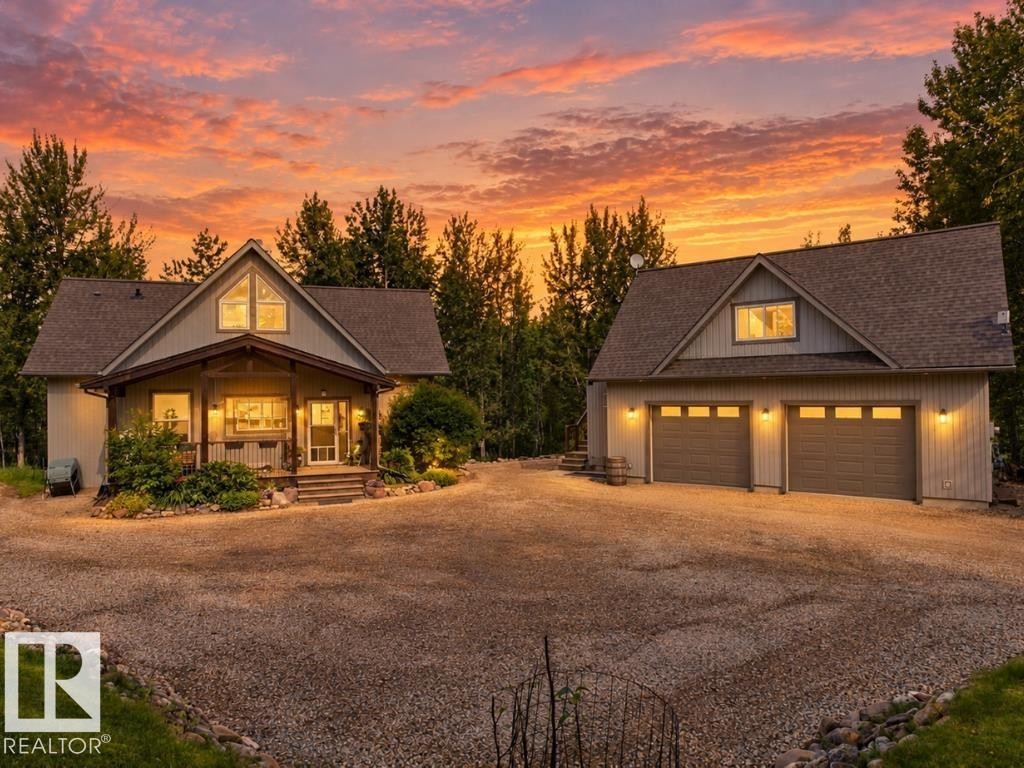 Main residence with covered porch and a detached two-car garage - #45 53122 Rge Road 14, Rural Parkland County, AB