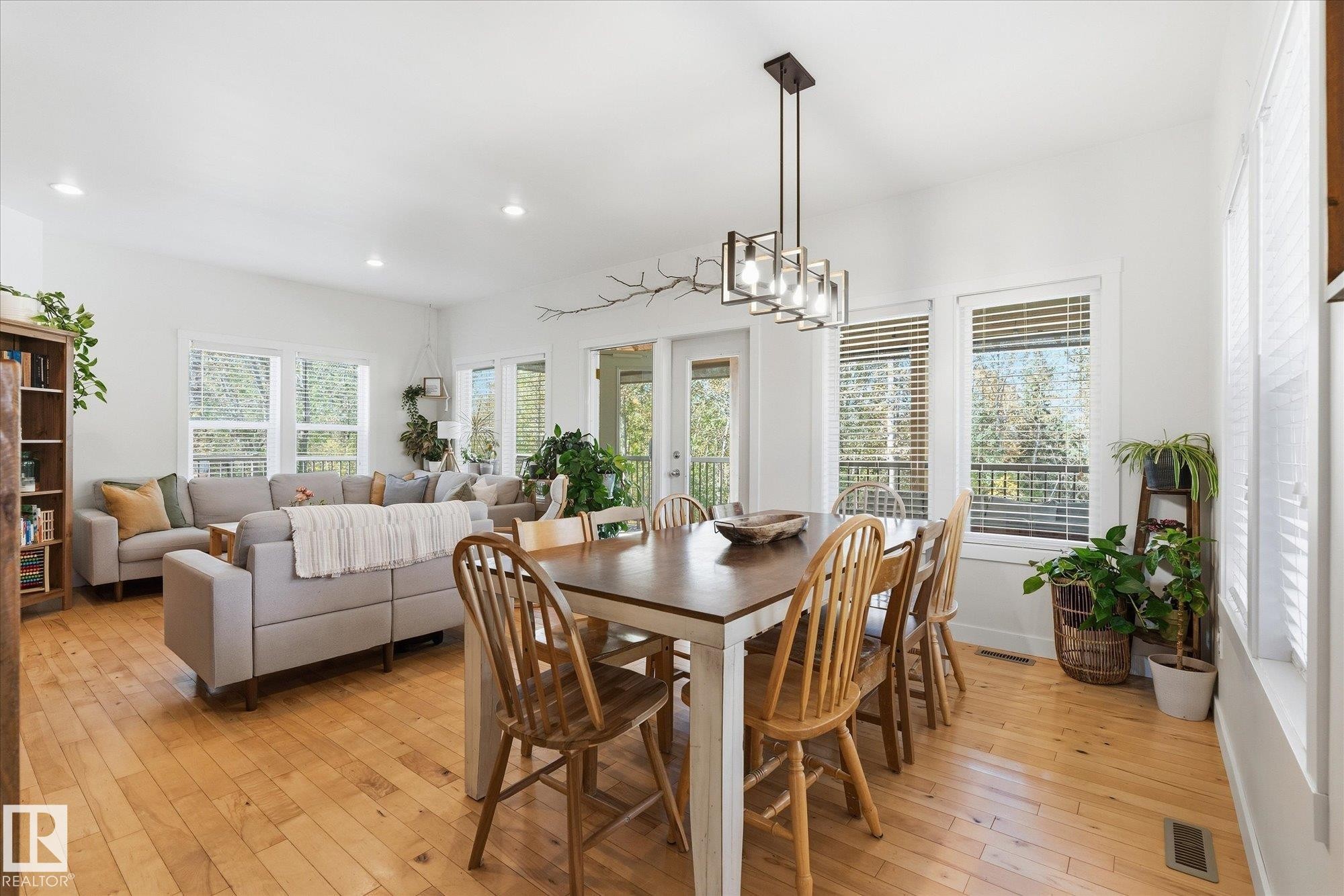 Open-concept living area with light wood-finish flooring - #45 53122 Rge Road 14, Rural Parkland County, AB