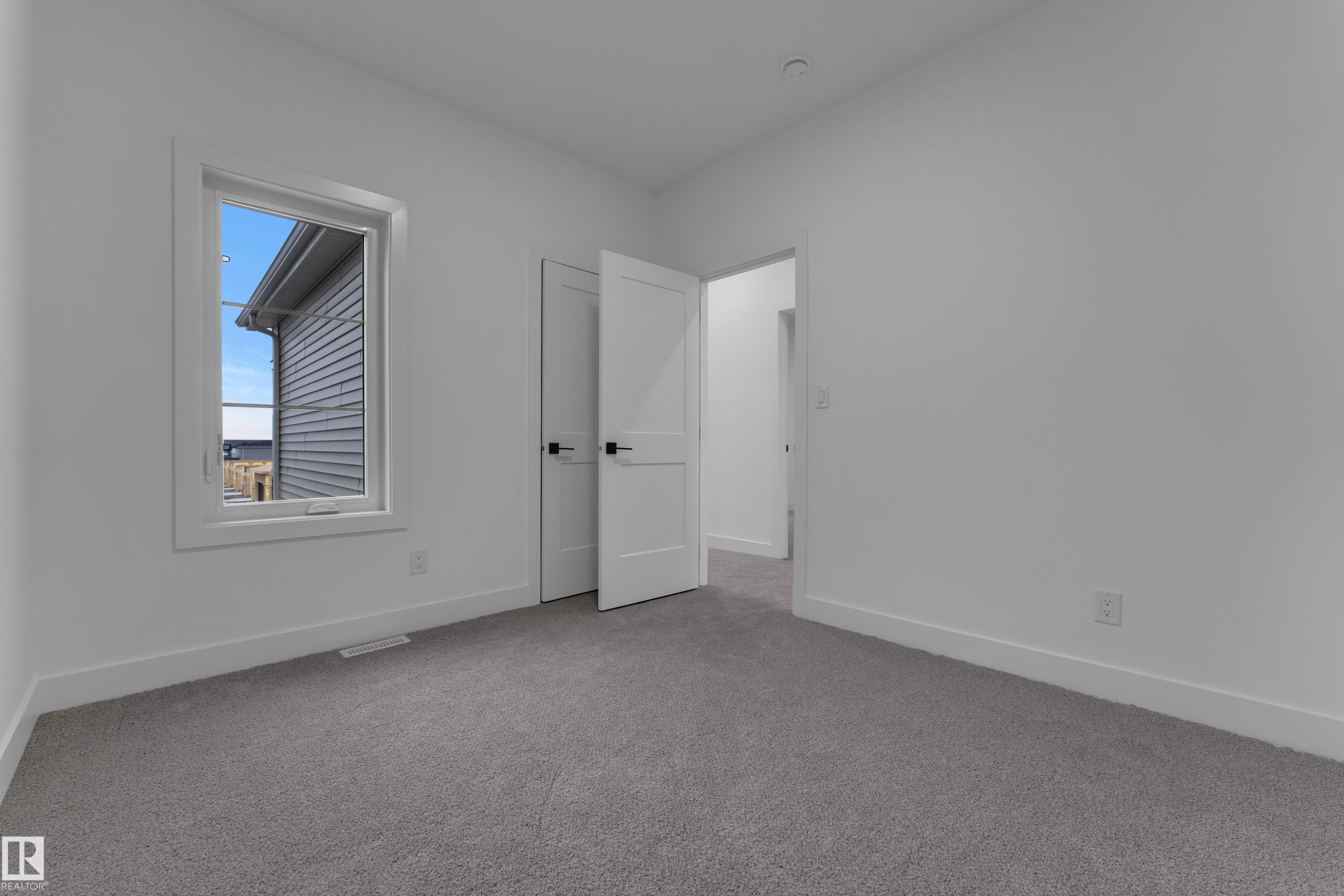 Neutral white walls throughout - 794 Bank Drive, Leduc, AB