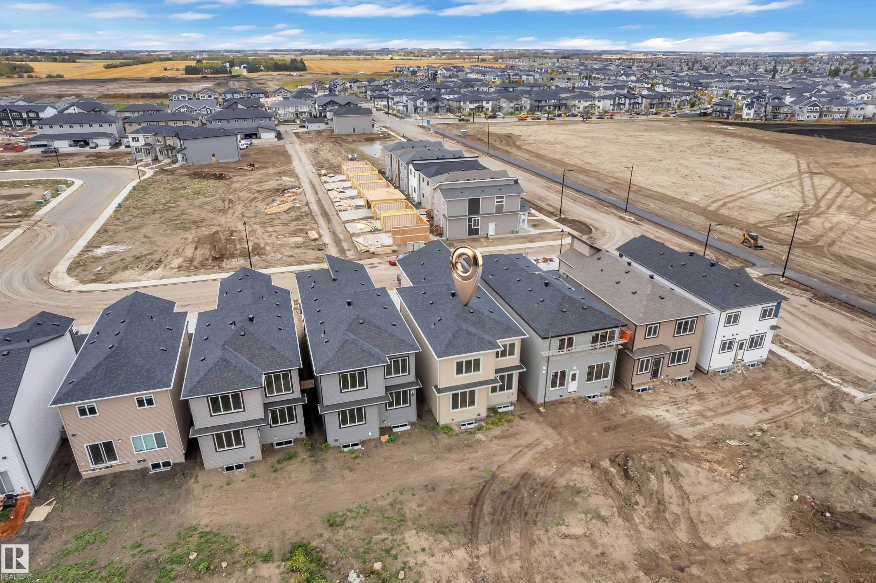 Developing suburban neighborhood with multiple residential properties and infrastructure - 794 Bank Drive, Leduc, AB