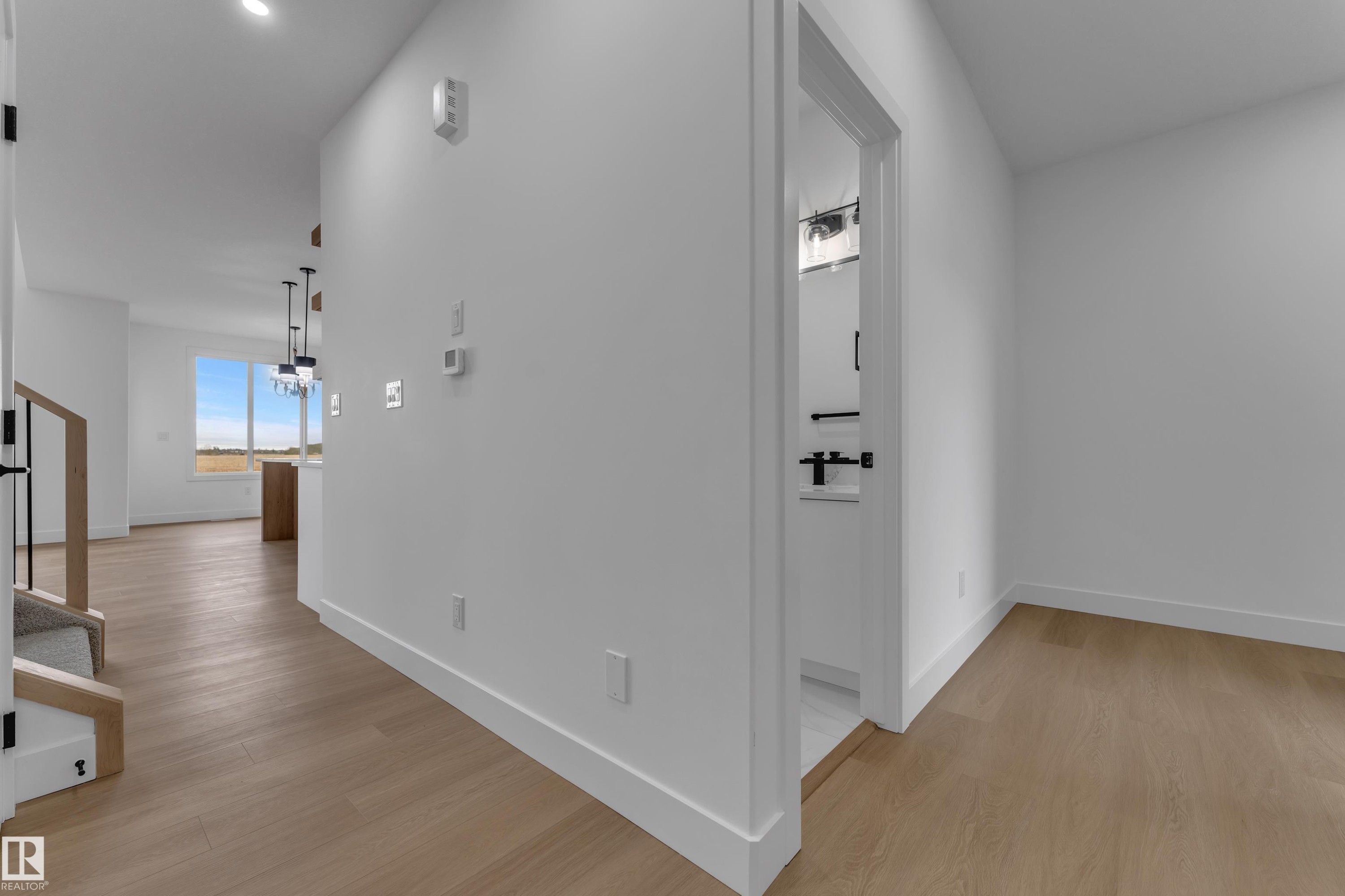 Hardwood-style flooring throughout - 794 Bank Drive, Leduc, AB