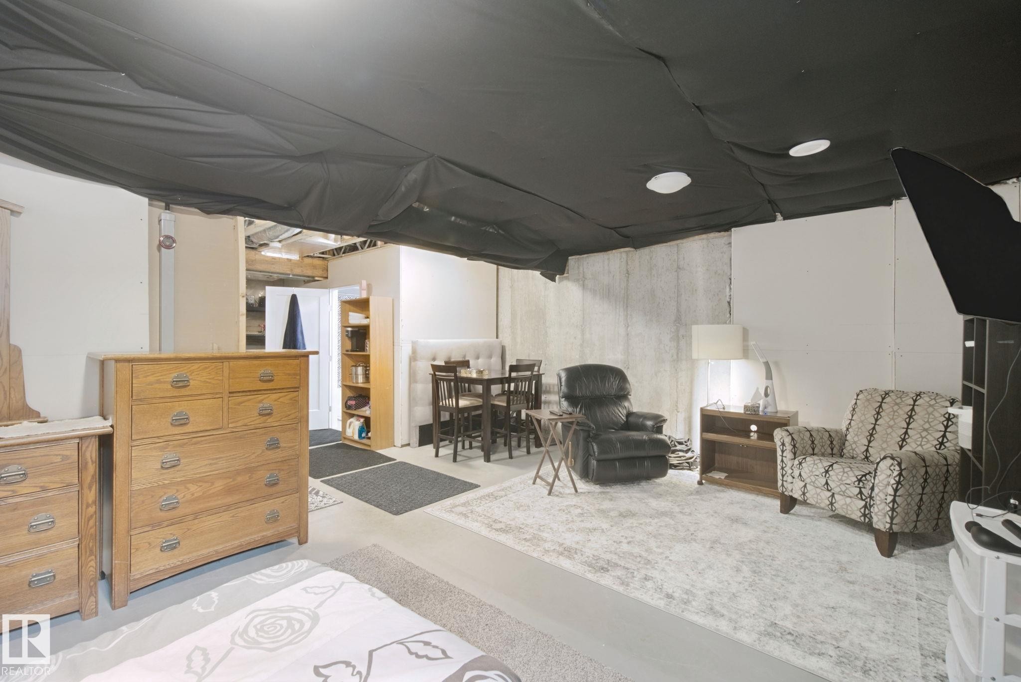 Recessed lighting, concrete flooring, exposed ceiling joists, and white wall finishes - 153 Cavanagh Common Sw, Edmonton, AB