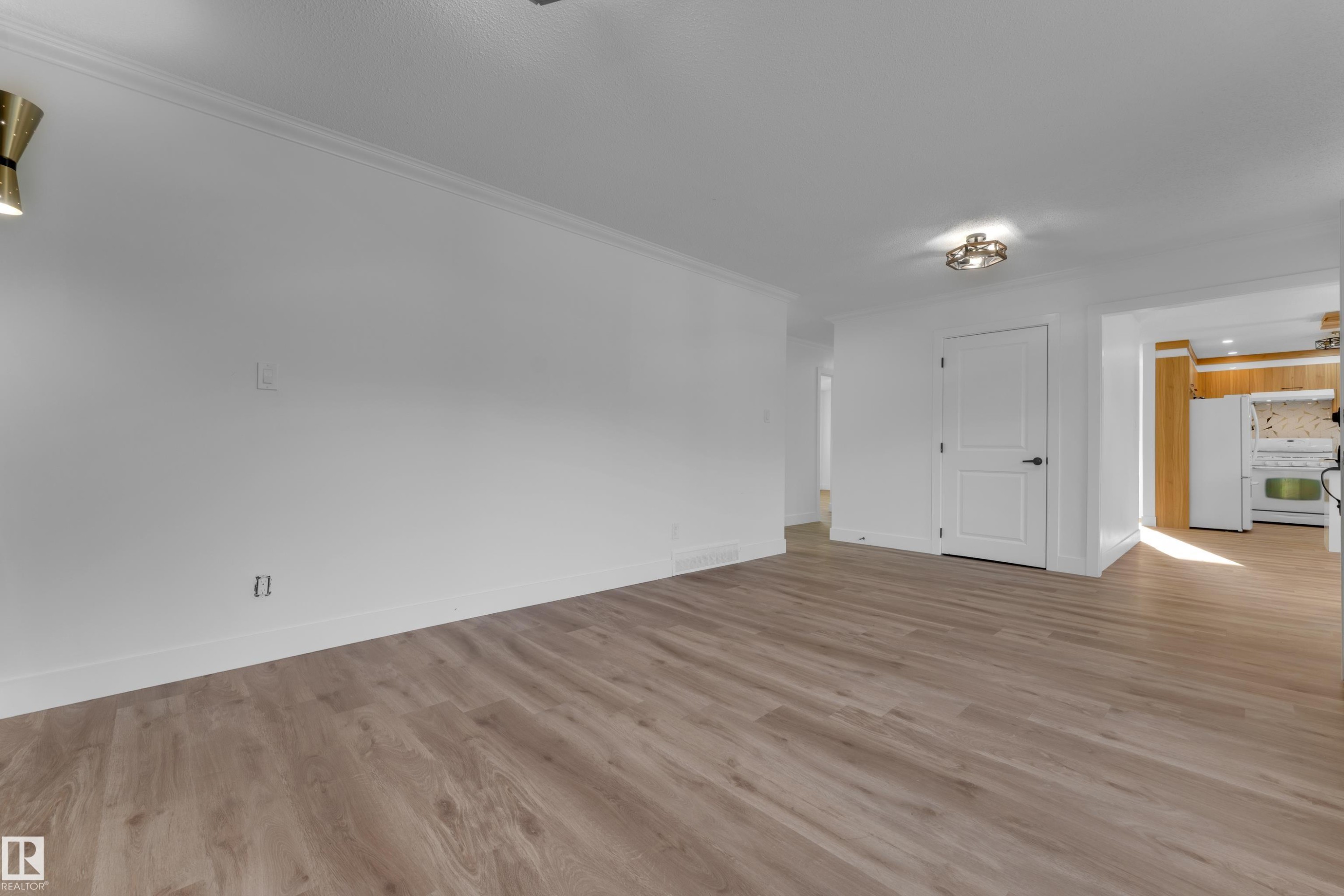 Wood-finish flooring, white walls, and a contemporary ceiling light fixture - 52314 Rge Road 215, Rural Strathcona County, AB