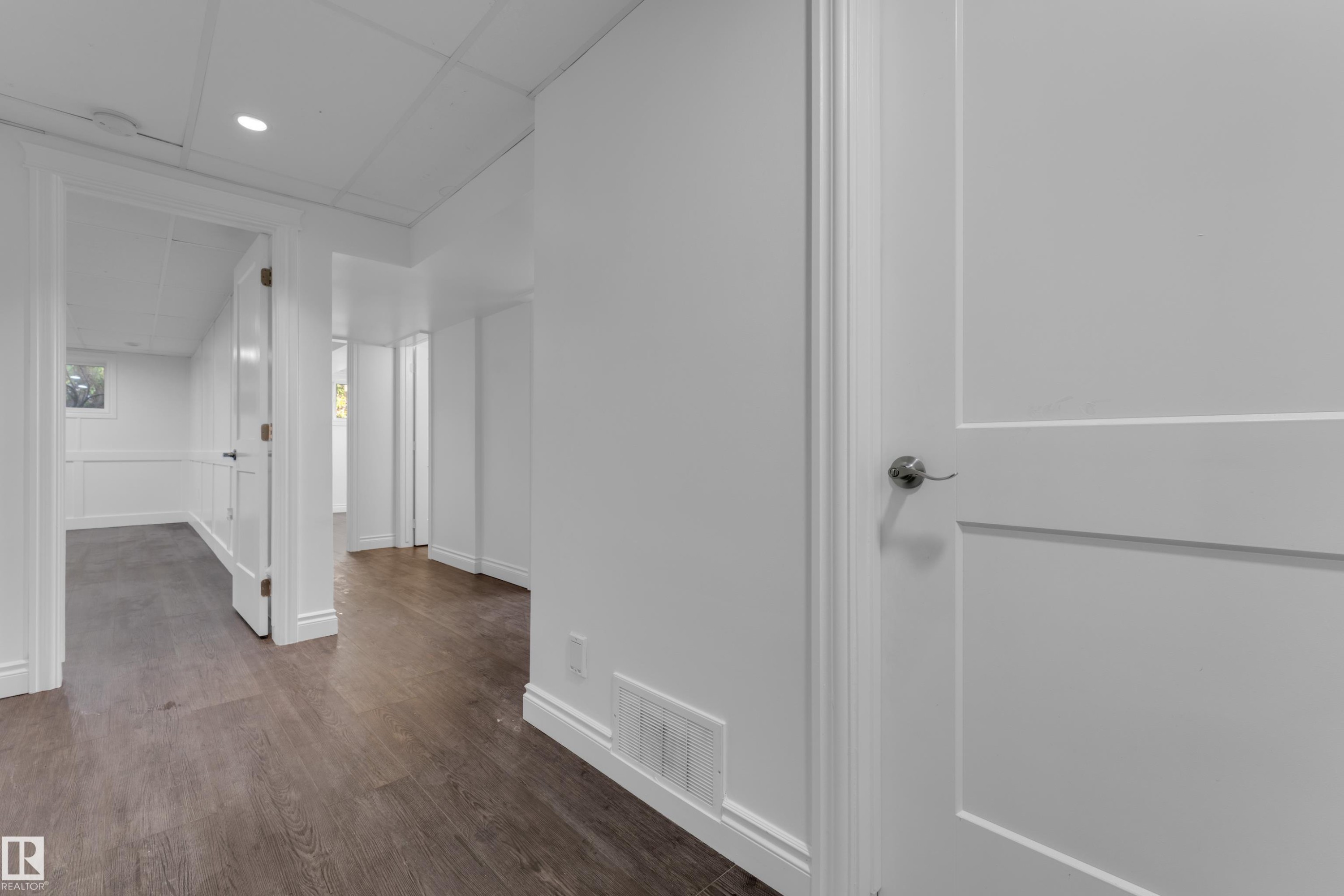 Wood-finish flooring throughout, white trim, recessed lighting, and white paneled doors - 52314 Rge Road 215, Rural Strathcona County, AB