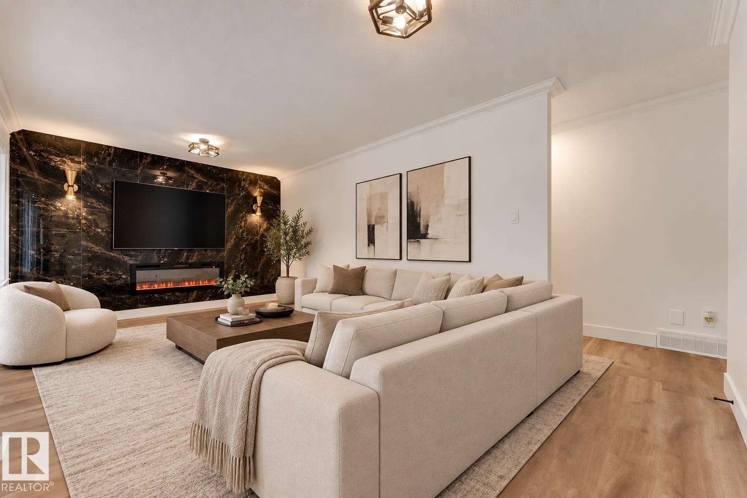 Feature wall with a built-in electric fireplace and mounted television, recessed lighting, and wall-mounted sconces - 52314 Rge Road 215, Rural Strathcona County, AB