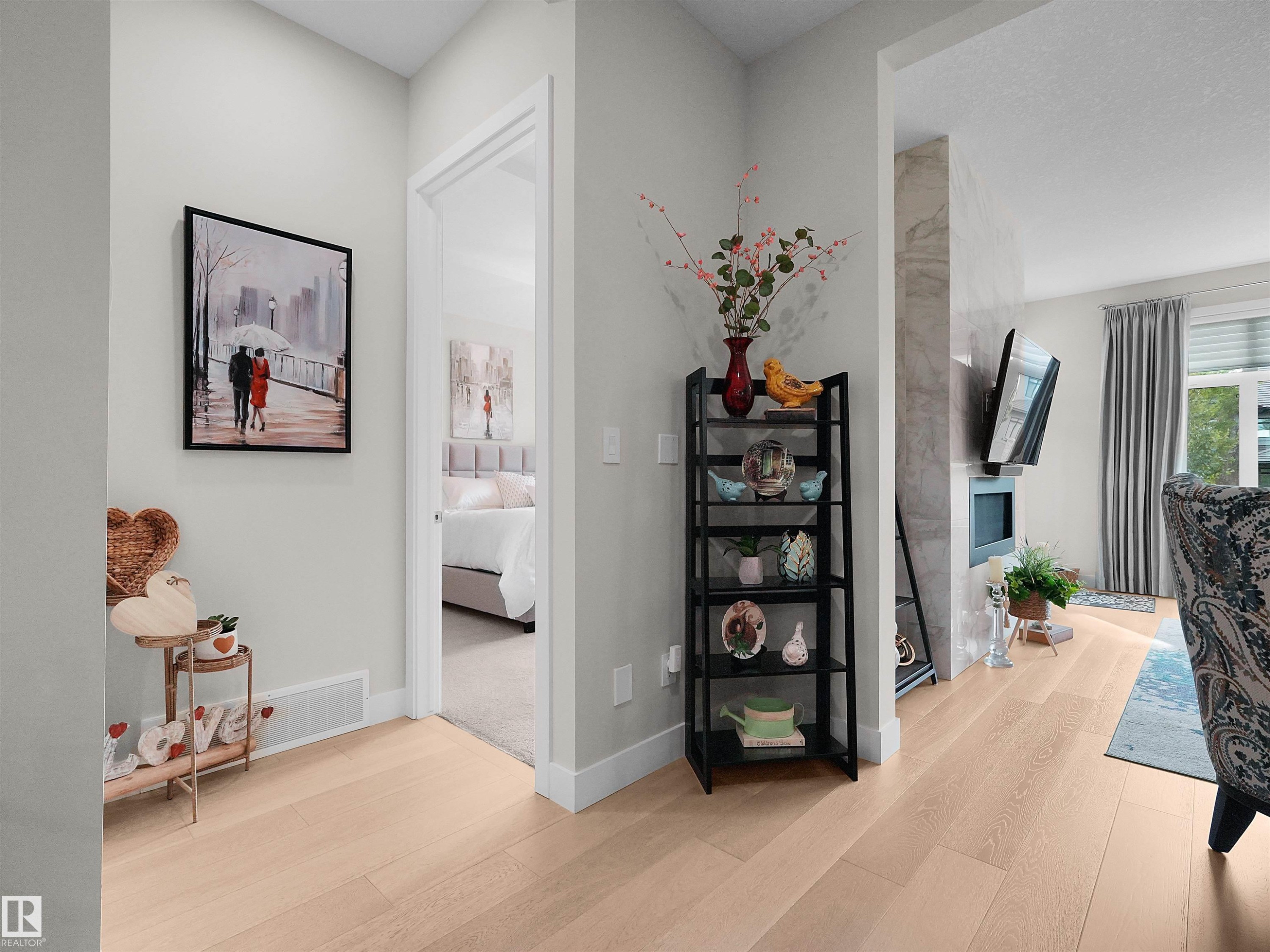 Light wood-finish flooring throughout, offering a bright and cohesive aesthetic - 904 Wood Place Nw, Edmonton, AB