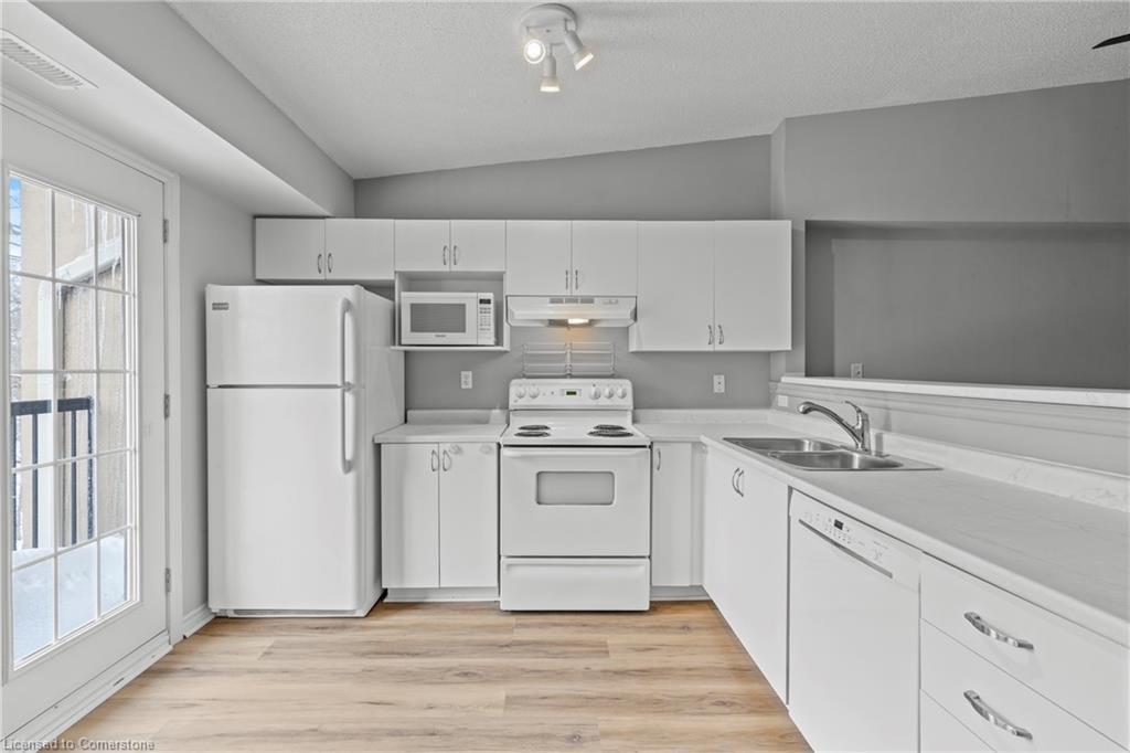 407-2075 Appleby Line, Burlington, ON - Indoor Photo Showing Kitchen With Double Sink