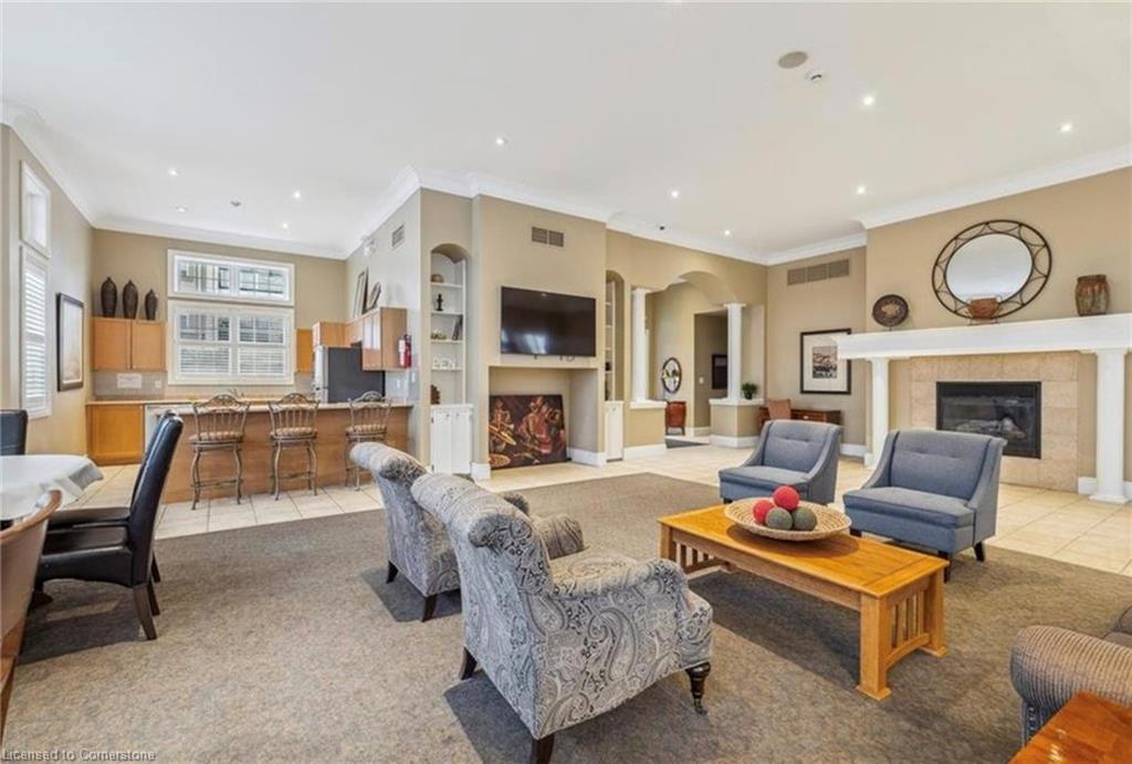 407-2075 Appleby Line, Burlington, ON - Indoor Photo Showing Living Room With Fireplace