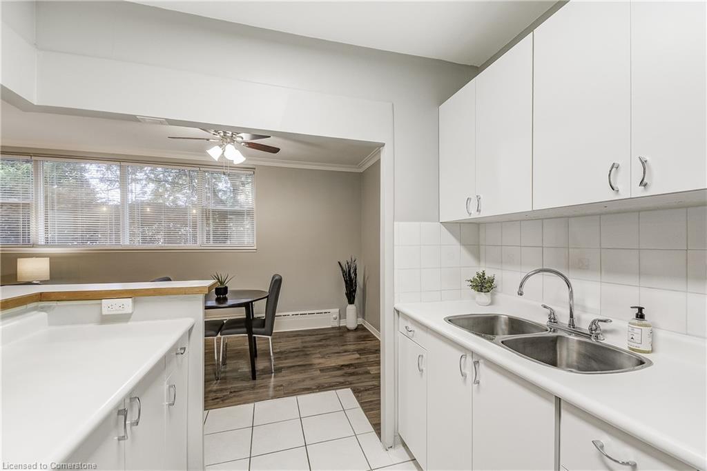 104-2052 Courtland Drive, Burlington, ON - Indoor Photo Showing Kitchen With Double Sink