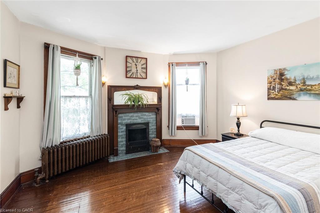 225 Broad Street E, Dunnville, ON - Indoor Photo Showing Bedroom With Fireplace