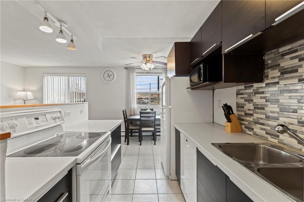 105-851 Queenston Road, Hamilton, ON - Indoor Photo Showing Kitchen With Double Sink
