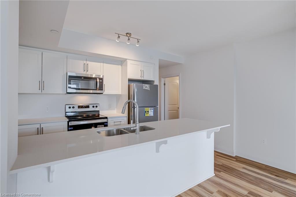 221-1936 Rymal Road E, Hamilton, ON - Indoor Photo Showing Kitchen With Stainless Steel Kitchen With Double Sink