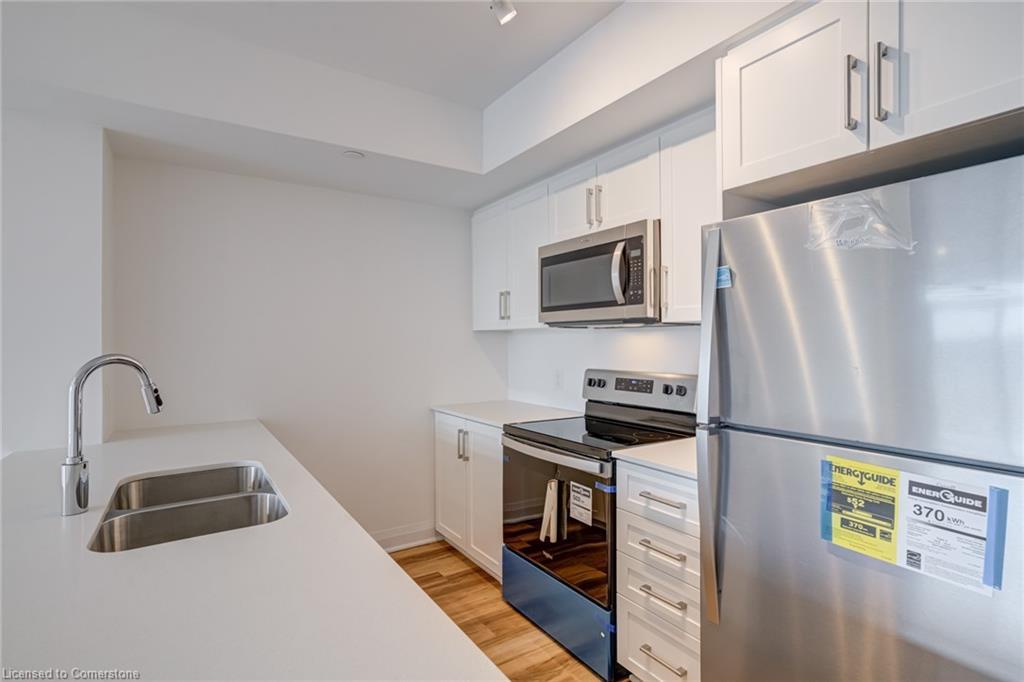 221-1936 Rymal Road E, Hamilton, ON - Indoor Photo Showing Kitchen With Stainless Steel Kitchen With Double Sink