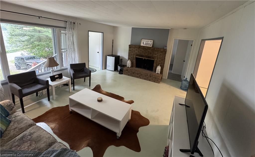 5803 Haliburton Lake Road, Dysart, ON - Indoor Photo Showing Living Room With Fireplace