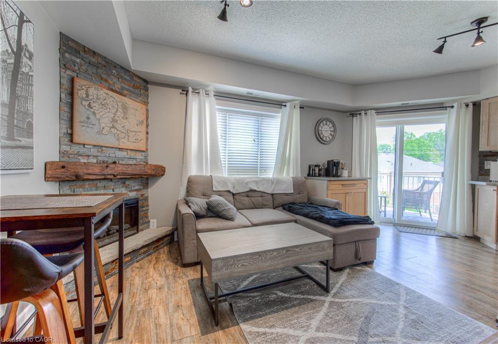 407-155 Water Street S, Cambridge, ON - Indoor Photo Showing Living Room With Fireplace
