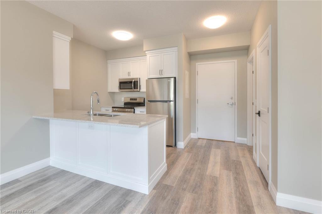 1-33 Murray Court, Milverton, ON - Indoor Photo Showing Kitchen With Double Sink