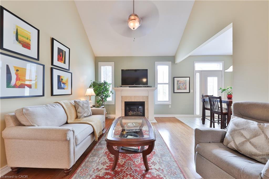 127-2125 Itabashi Way, Burlington, ON - Indoor Photo Showing Living Room With Fireplace
