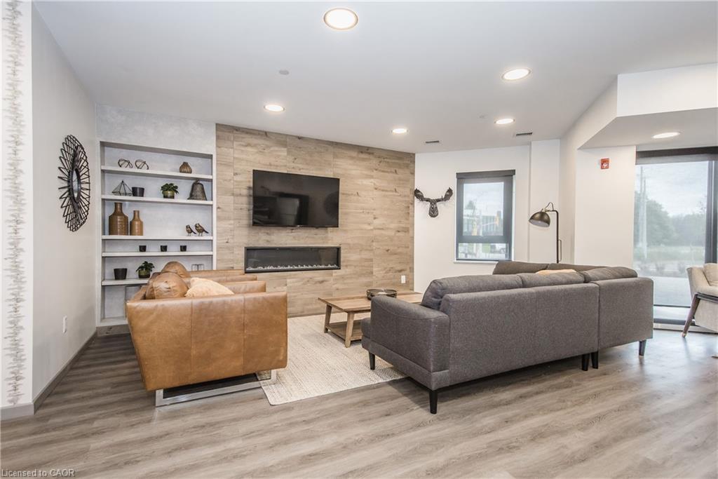 102-332 Gosling Gardens, Guelph, ON - Indoor Photo Showing Living Room With Fireplace