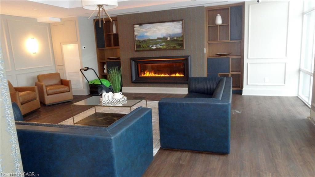 1005-450 Dundas Street E, Waterdown, ON - Indoor Photo Showing Living Room With Fireplace