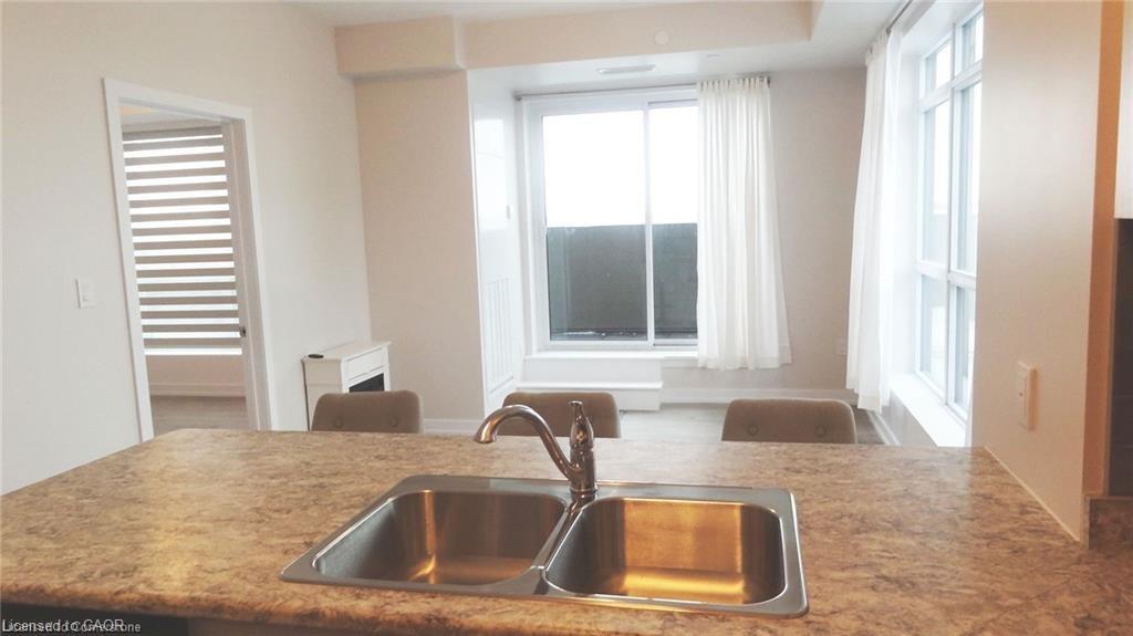 1005-450 Dundas Street E, Waterdown, ON - Indoor Photo Showing Kitchen With Double Sink