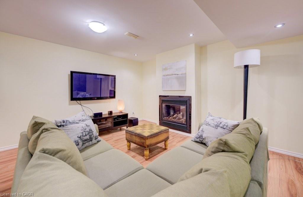 704 Shediac Crescent, Waterloo, ON - Indoor Photo Showing Living Room With Fireplace