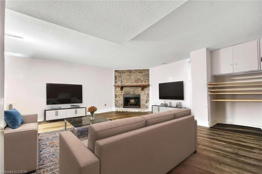 101-121 University Avenue E, Waterloo, ON - Indoor Photo Showing Living Room With Fireplace