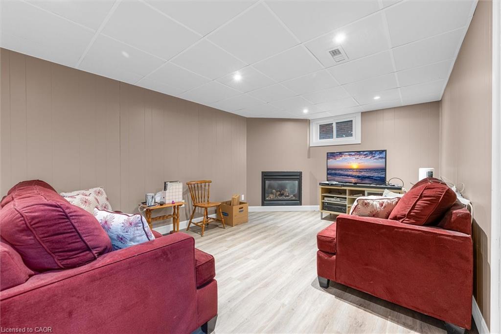 5073 Charles Street, Beamsville, ON - Indoor Photo Showing Basement With Fireplace