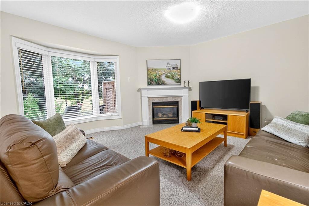 282 Centennial Forest Drive, Milton, ON - Indoor Photo Showing Living Room With Fireplace