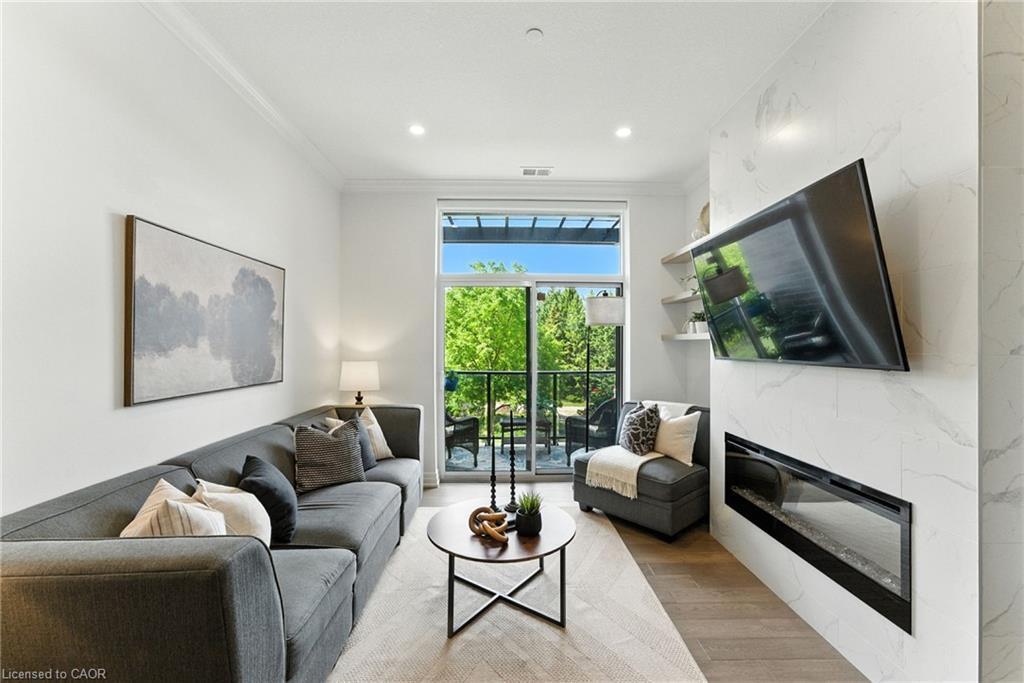 207-1880 Gordon Street, Guelph, ON - Indoor Photo Showing Living Room With Fireplace