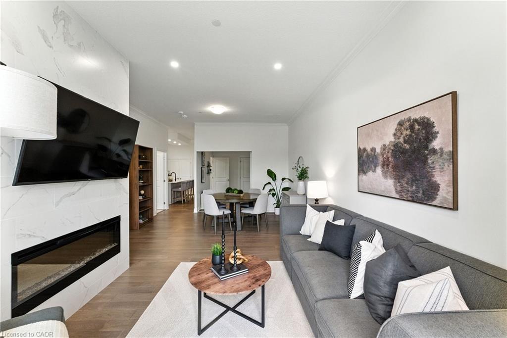 207-1880 Gordon Street, Guelph, ON - Indoor Photo Showing Living Room With Fireplace