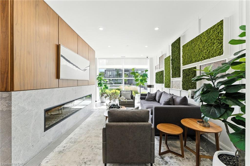 207-1880 Gordon Street, Guelph, ON - Indoor Photo Showing Living Room With Fireplace