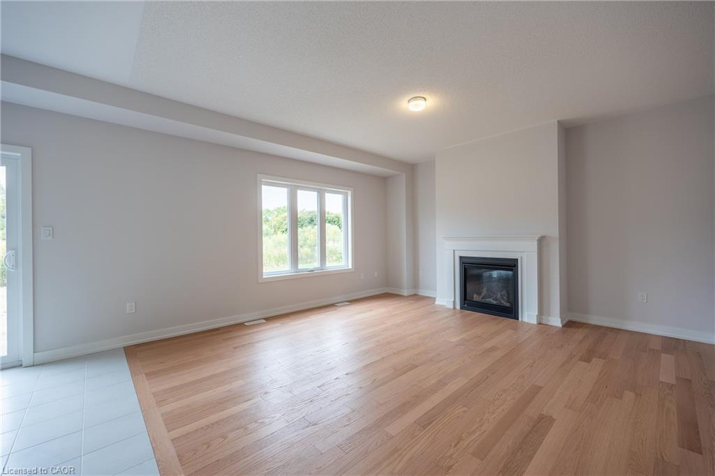 6 Butternut Drive, Simcoe, ON - Indoor Photo Showing Living Room With Fireplace