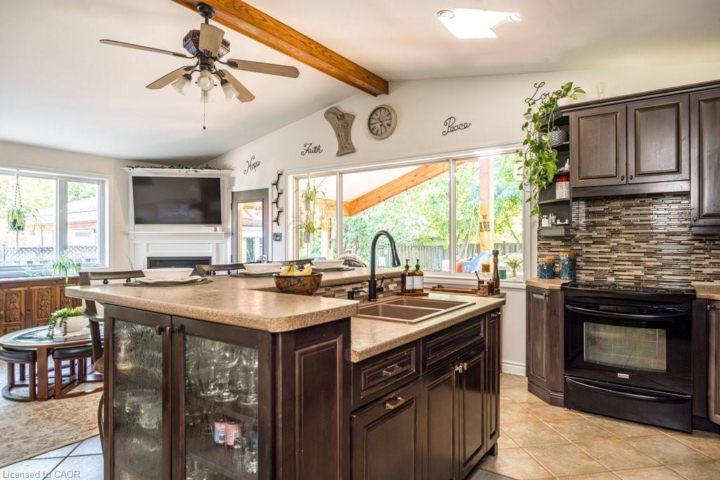 87 East 9Th Street, Hamilton, ON - Indoor Photo Showing Kitchen With Fireplace With Double Sink