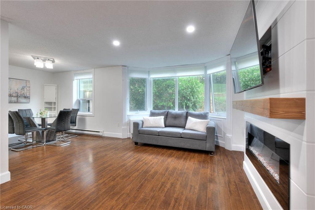103-35 Green Valley Drive, Kitchener, ON - Indoor Photo Showing Living Room With Fireplace